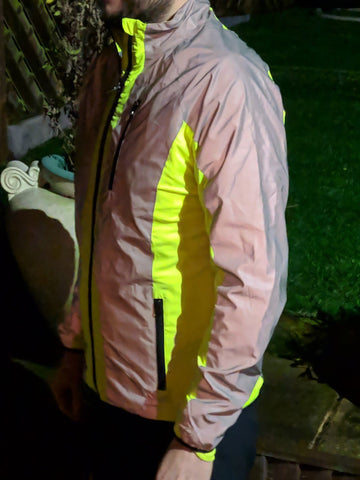 High vis & reflective cycling jacket shown worn , bright high vis