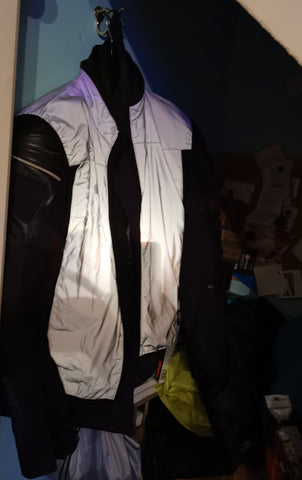 BTR Be Totally Reflective gilet shone over a motorbike jacket 