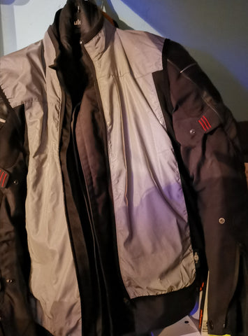 BTR Be Totally Reflective gilet shone over a motorbike jacket 