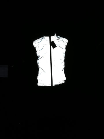 BTR reflective silver high vis running and cycling gilet worn by man in the dark