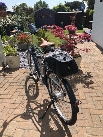 BTR Bike Rack on a bicycle!  Lovely garden photo! 